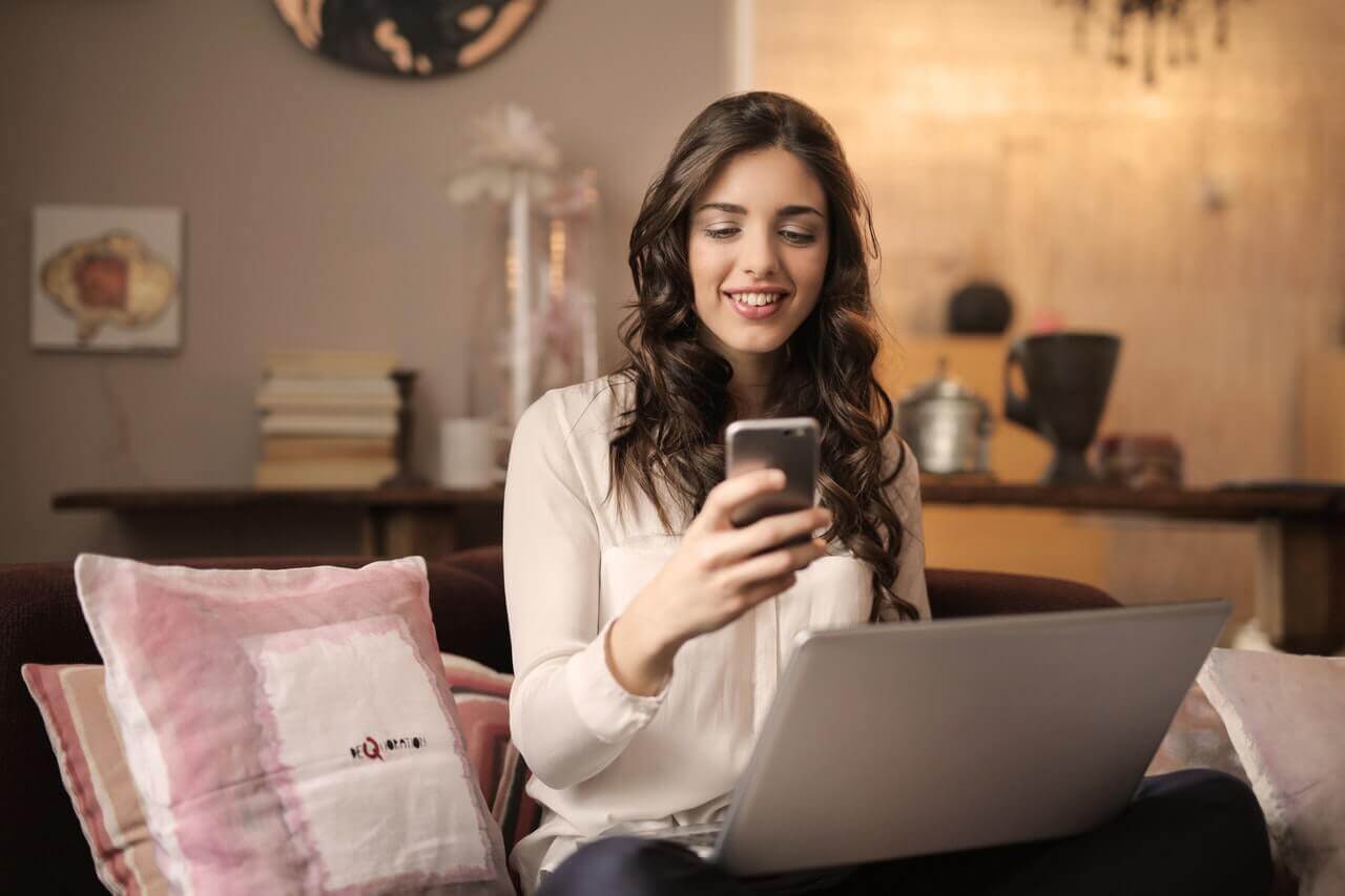 Woman working from home on sofa